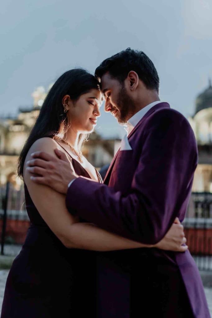 Cinematic still from a wedding film — couple in a film-like dramatic frame