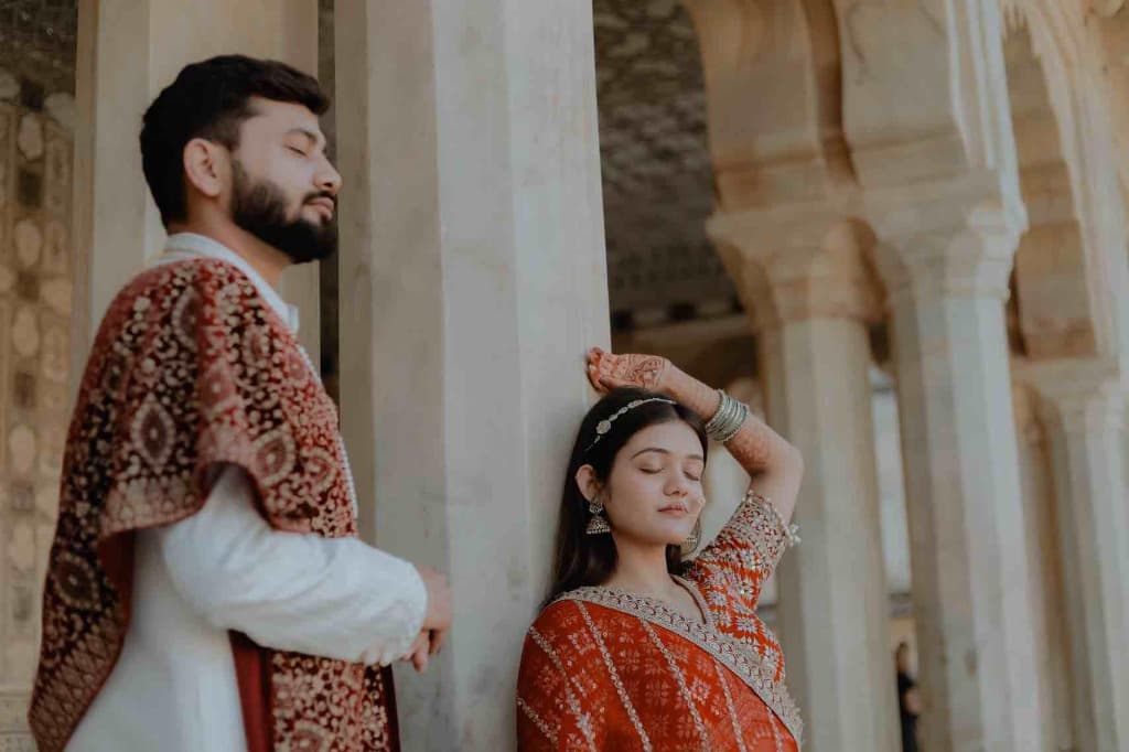 Emotional wedding ceremony candid — varmala moment at a Jaipur palace